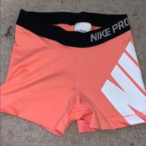 Salmon Nike Pros